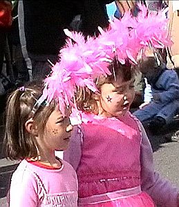 girl in big pink feather hat